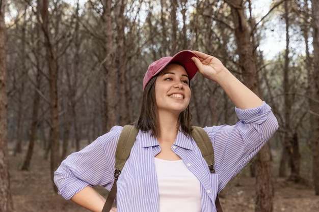Does wearing cap affect hair growth - Woman wearing baseball cap outdoors, wondering if it affects hair growth.